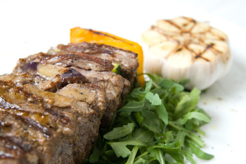 shashlik with potherbs on the plate