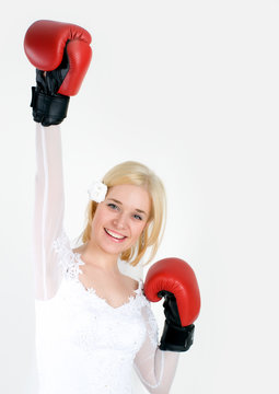 bride wearing boxing gloves