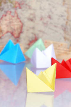 Paper Boats On Background With Map