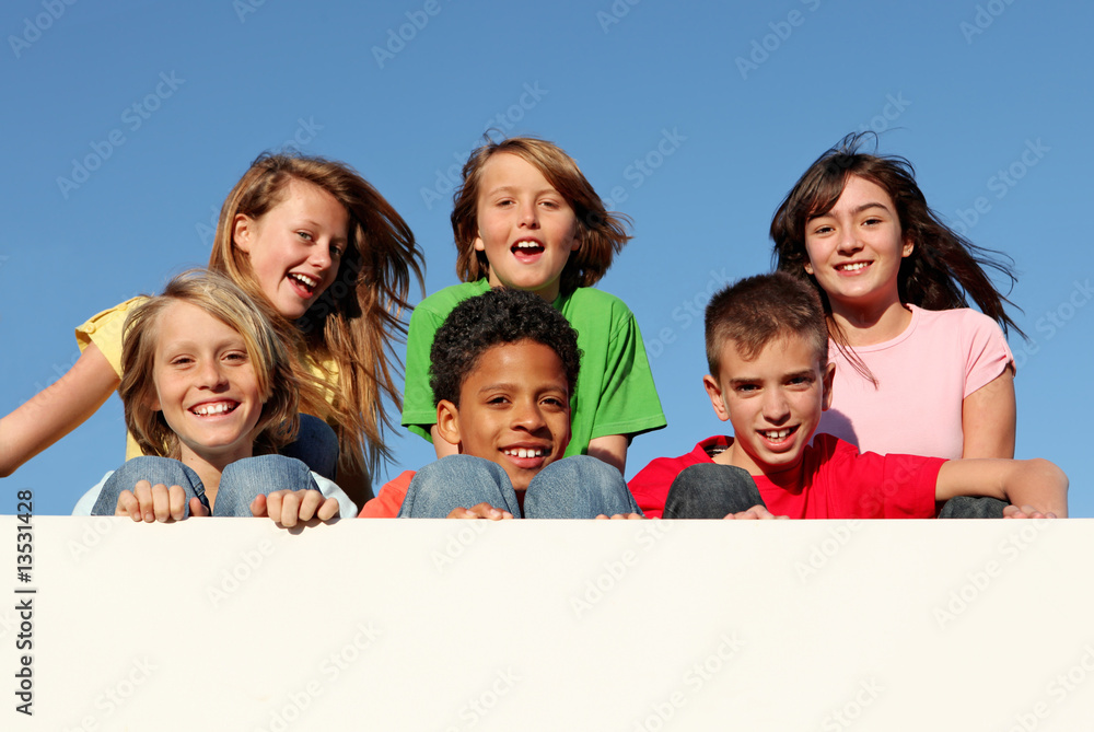 Wall mural diverse group of kids holding banner at summer camp