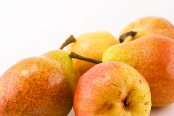 Five pears on a white background
