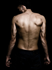 Fototapeta premium Artistic grunge image of man with muscular back