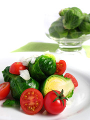 Fresh organic salad of Brussel sprouts and cherry tomatoes