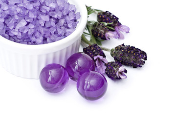 Fototapeta premium Spa essentials (bath salt, oil pearls and flowers of lavender)