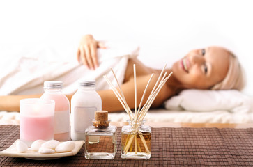 Fototapeta na wymiar Young woman lying at spa. aromatherapy relaxation