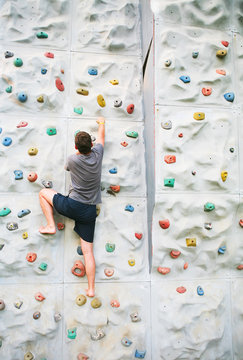 man climbing a wall