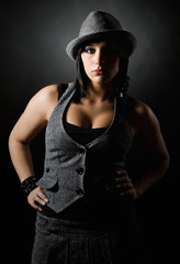 Low Key Shot of a Beautiful Mediterranean Girl with Hat