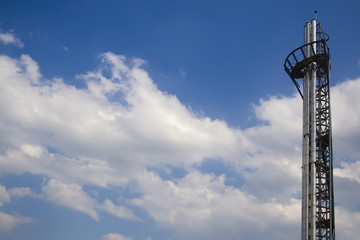 A futuristic boiler chimney on the blue sky