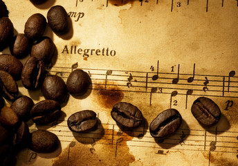 Coffee beans on a grungy musical background