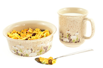 cornflakes with milk in a cup