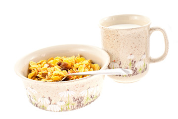cornflakes with milk in a cup