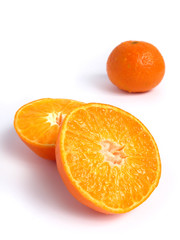 Organic Tangerine cut in half, on white background