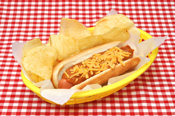Hot Dog with Chili, Cheese, and Potato Chips in Basket