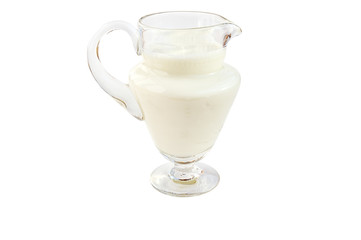 Pitcher of milk isolated over white with clipping path.