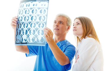 Two doctors look x-ray films