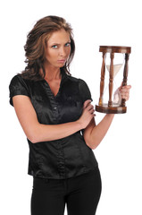 Businesswoman holding a sand timer
