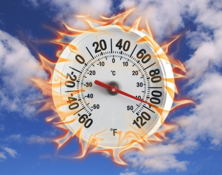 Burning thermometer on blue sky