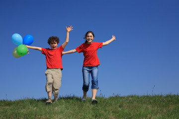 Kids holding balloons ,playing outdoor