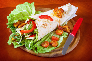 Closeup fresh tortilla on wooden tray