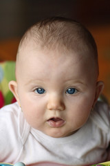 Baby looking up at camera