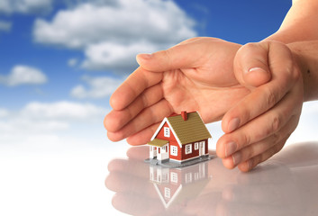 Hands and little house.