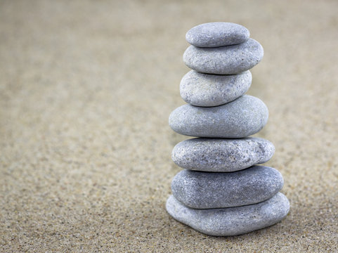 Balancing Pebbles Placed On Sand