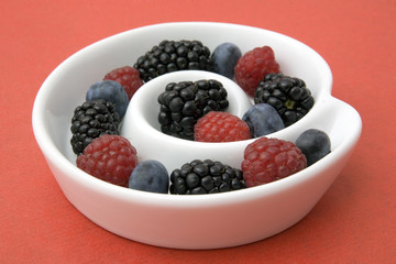 different berries in a dish