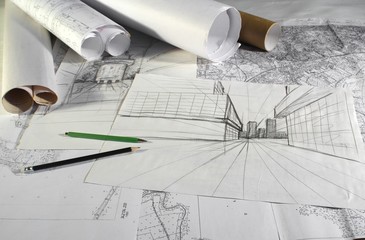 plans and drafts on architect's desk