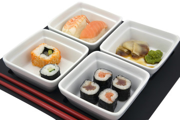sushi in white dishes