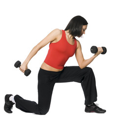 Girl is working out with dumbbells