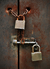 locks on rusty metal door