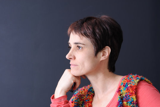 Profile Portrait Of Mature Woman On Dark Background