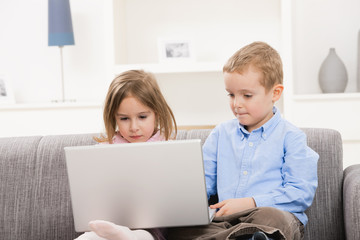 Children with laptop computer