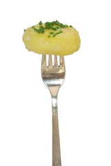 potato on fork on white background