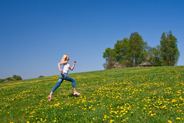 happy young woman on meadow