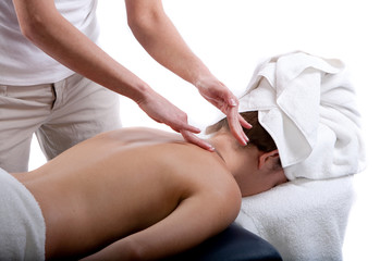 Obraz na płótnie Canvas Massage therapist doing back massage