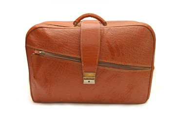 Old brown suitcase on a white background