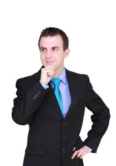 Cheerful young businessman thinking about.. Isolated