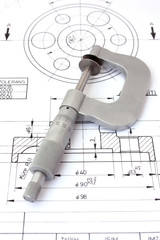 Micrometer on technical drawing. Vertical