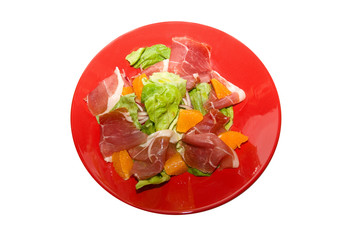 jamon with orange fruit and lettuce