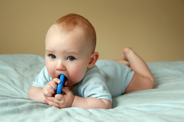 Baby playing with rattle