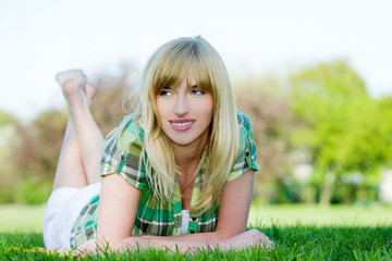 Beautiful woman laying on grass