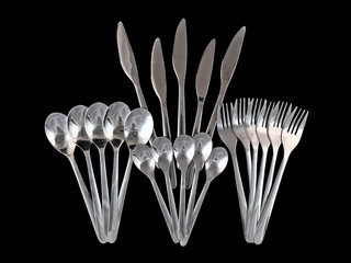 Covers-forks, knifes, spoons on black  background.
