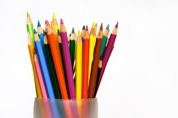 Assorted Colored Pencils in Glass
