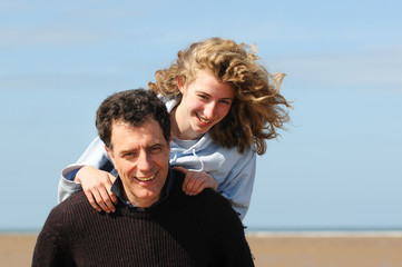 father and daughter at the beach
