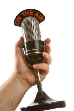 Microphone in Hand over white