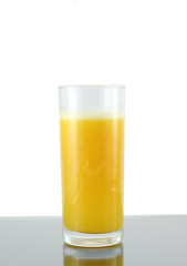 Glass of fresh orange juice . Isolated