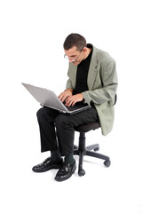 Man working with computer on a chair