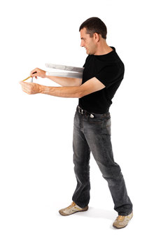 Man measuring the white walll