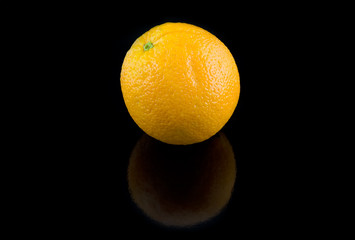 Single orange   on black  background.